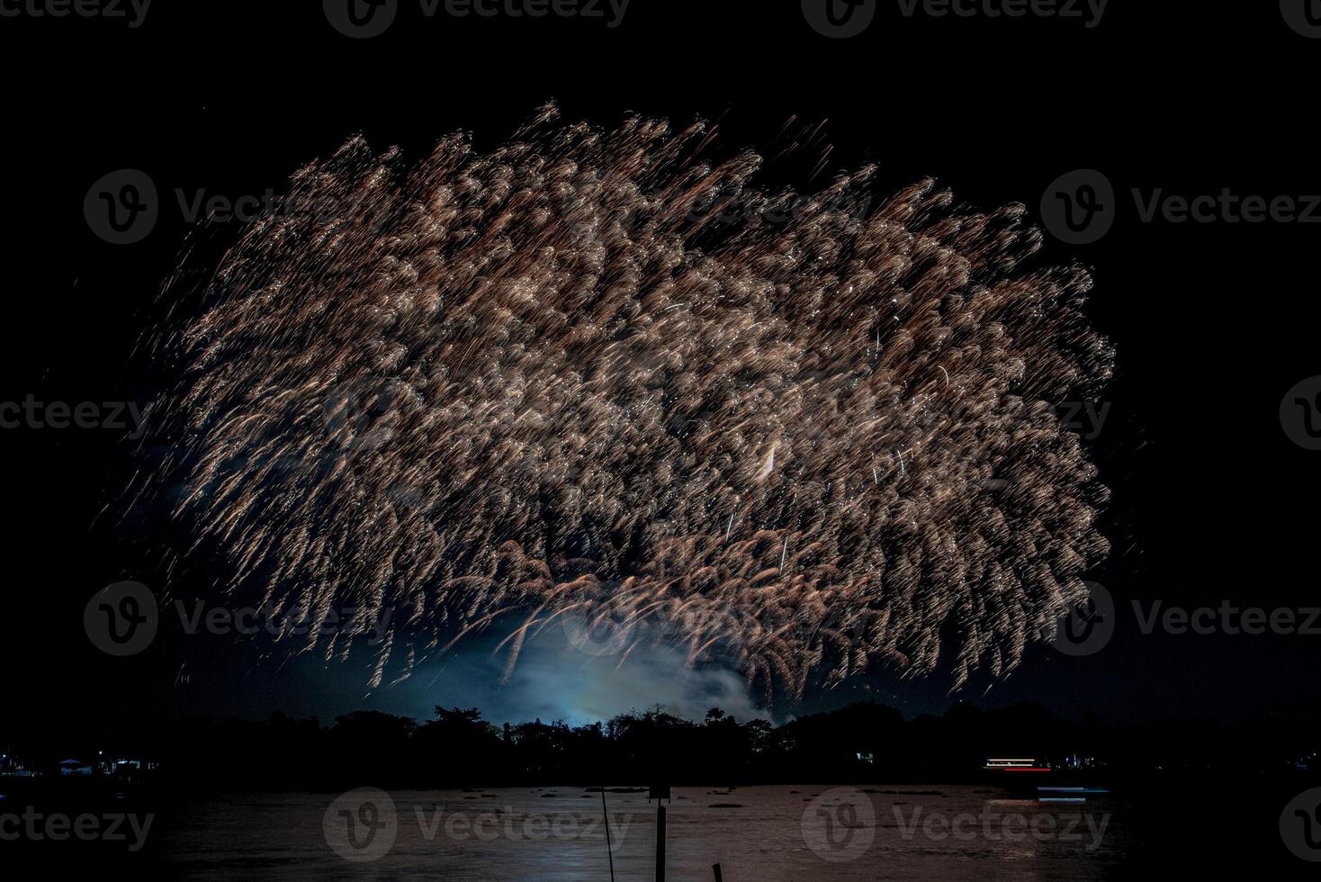 fireworks on the river in the dark sky photo