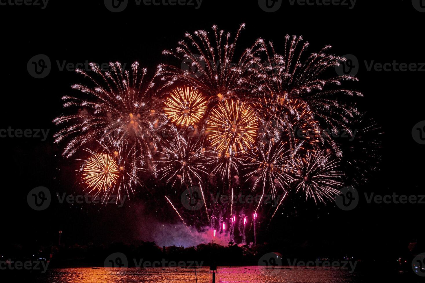 fireworks on the river in the dark sky photo