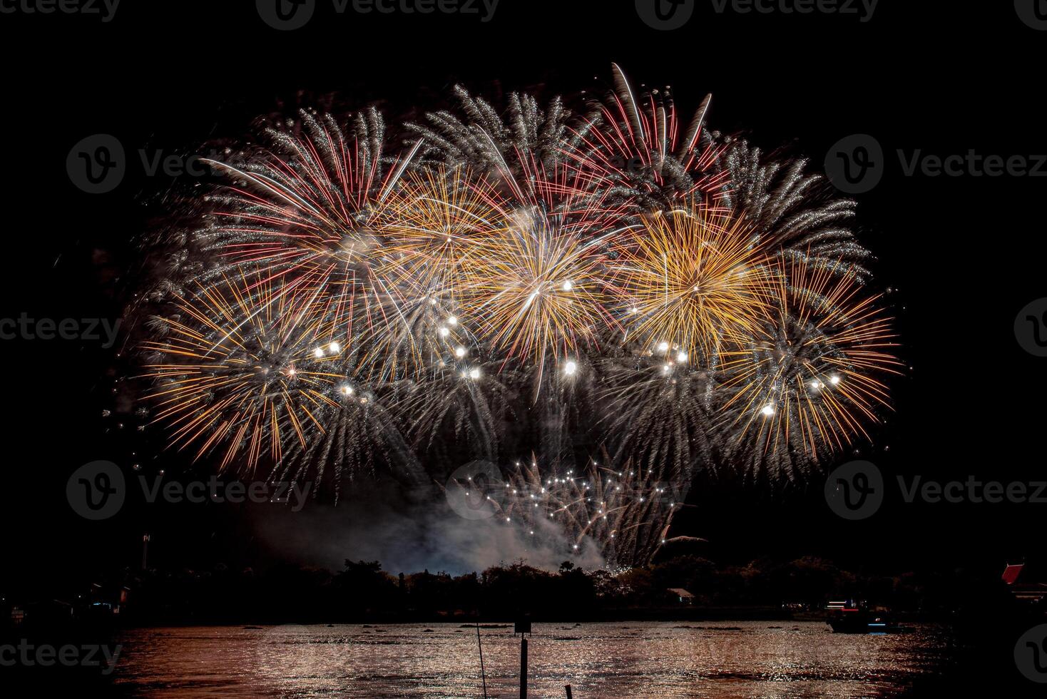 fireworks on the river in the dark sky photo