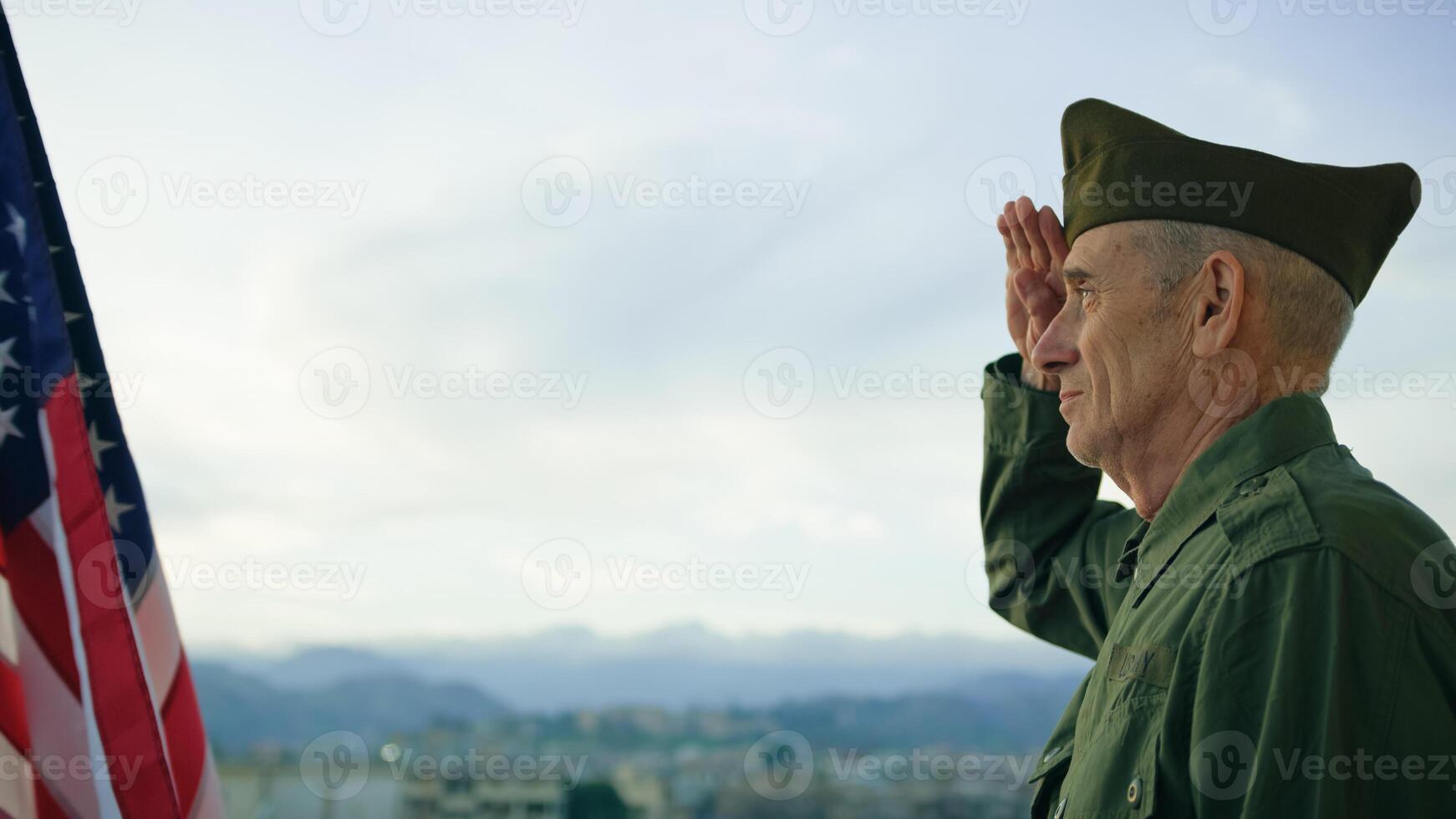 Elderly Man Stand Against American Flag For Veterans Day Holiday photo