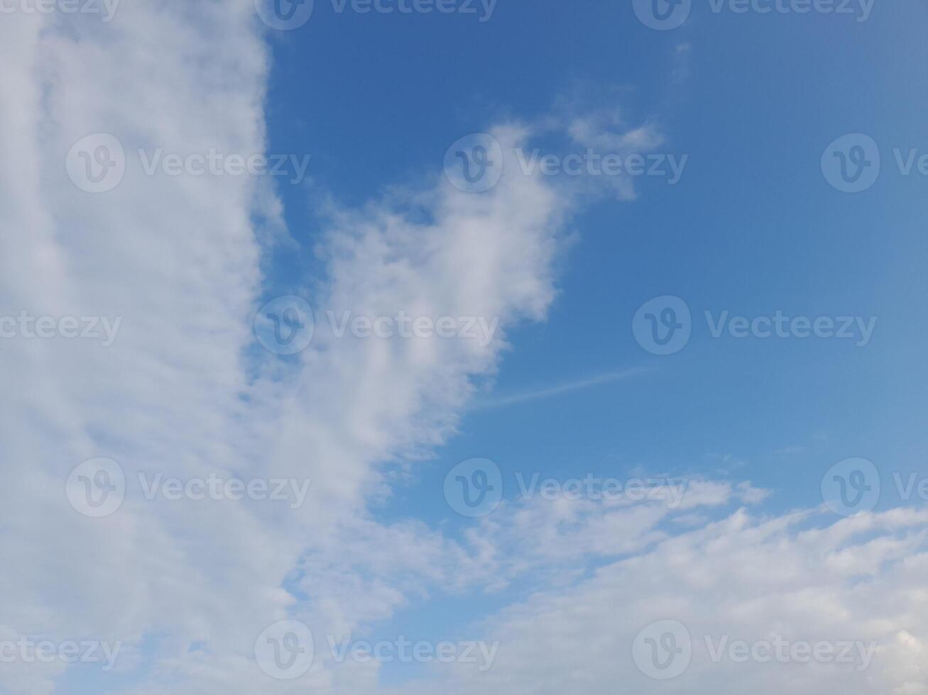 The white clouds on the blue sky are perfect for the background. Skyscape on Lombok Island, Indonesia photo