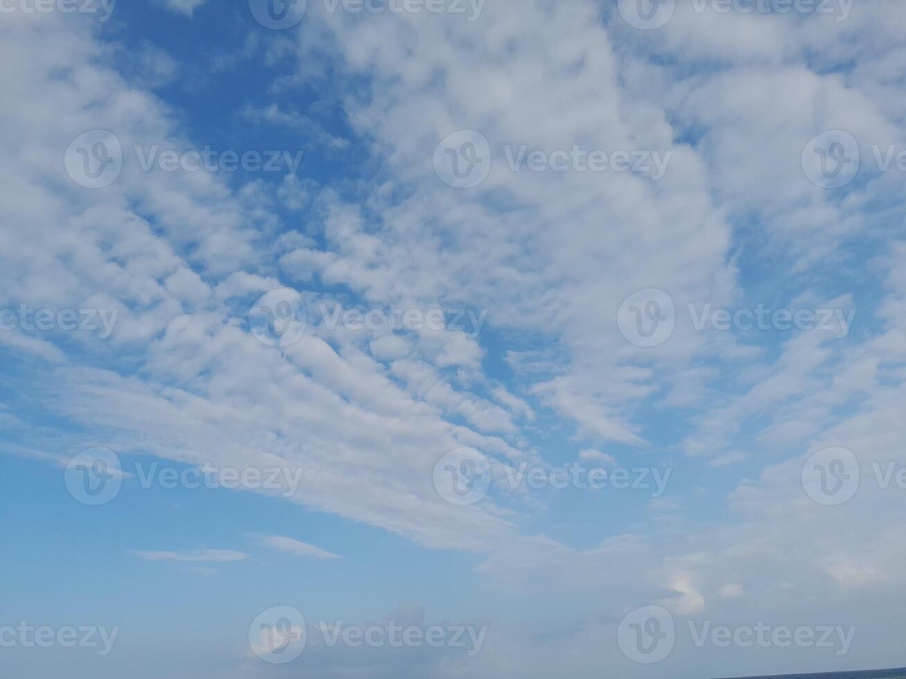 The white clouds on the blue sky are perfect for the background. Skyscape on Lombok Island, Indonesia photo