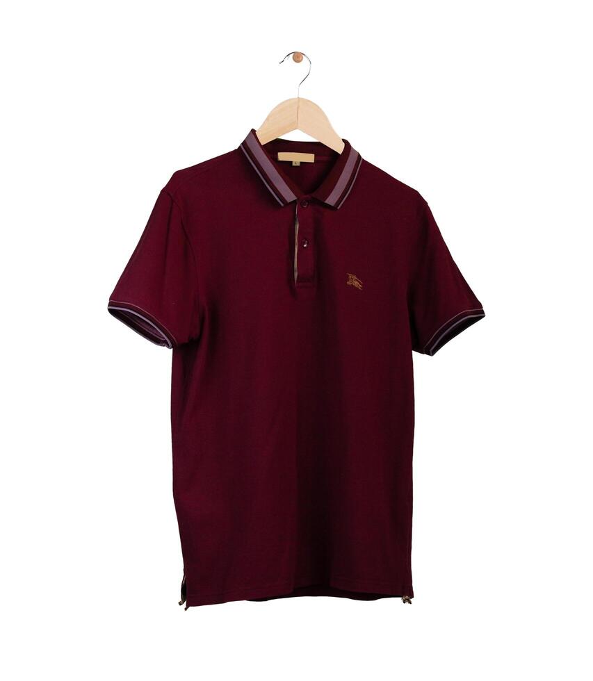 A dark Red Polo shirt, clothes on isolated white background. photo