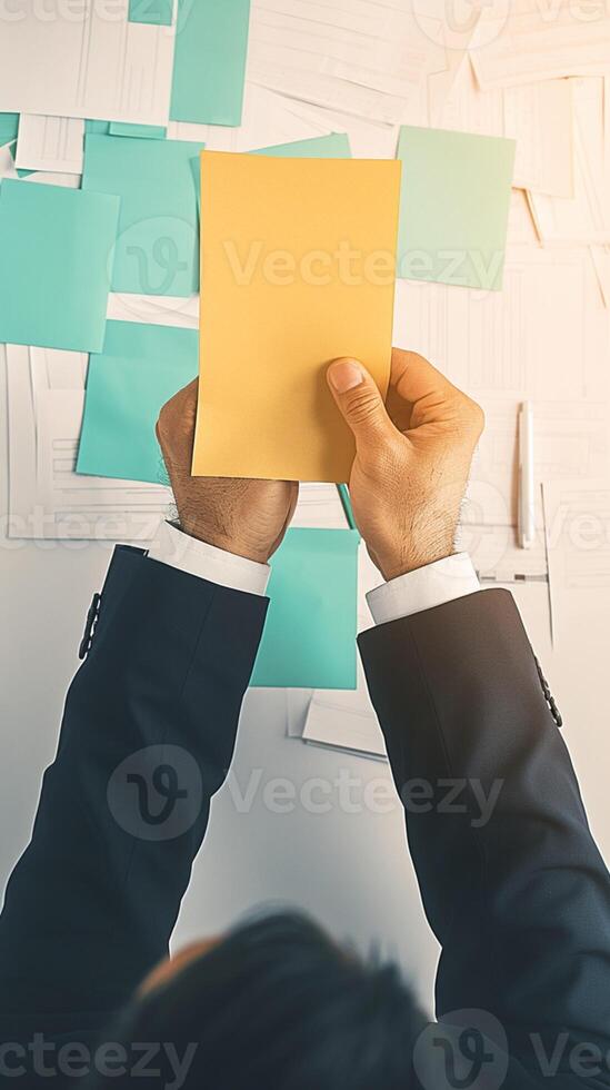 AI generated Corporate reminders Man holds post it notes for efficient business management Vertical Mobile Wallpaper photo