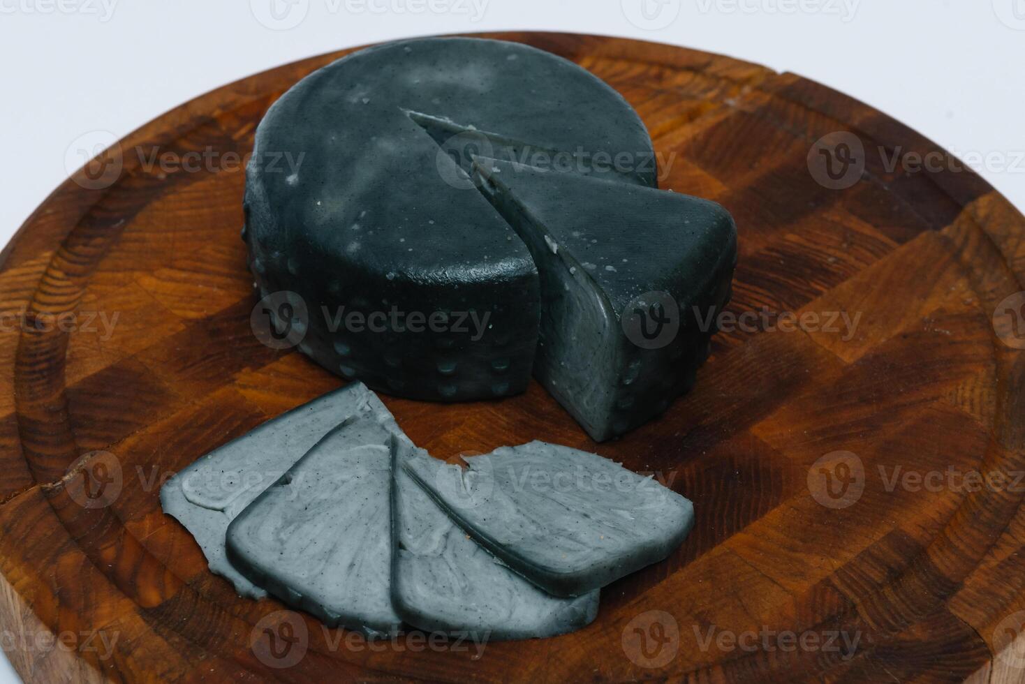 dark varieties of cheese on a white background photo