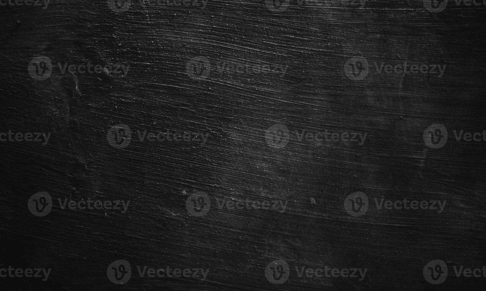 Black concrete texture as a concept of horror and Halloween. Dark wall background cement or stone. photo