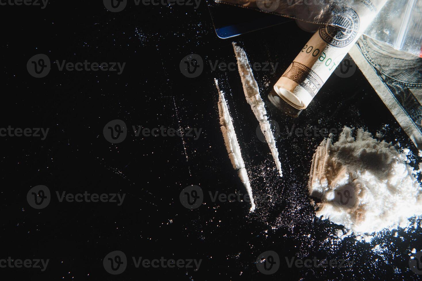 Hard drugs on black table. Close up. photo