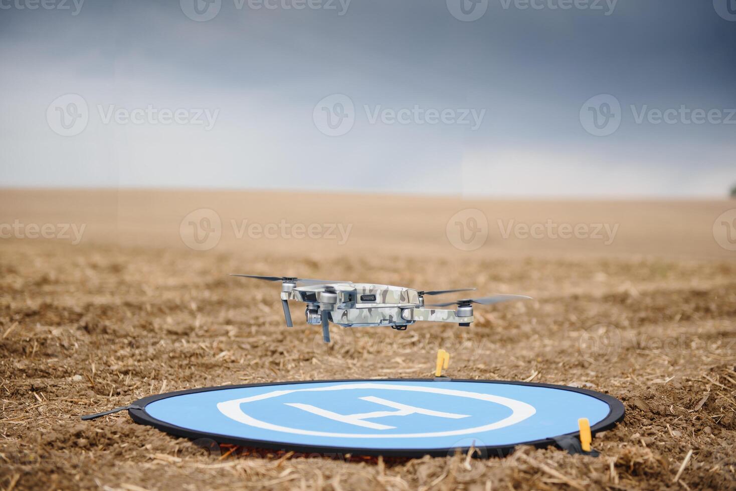 Drone flying during the day in field. The use of drones in the agricultural business photo