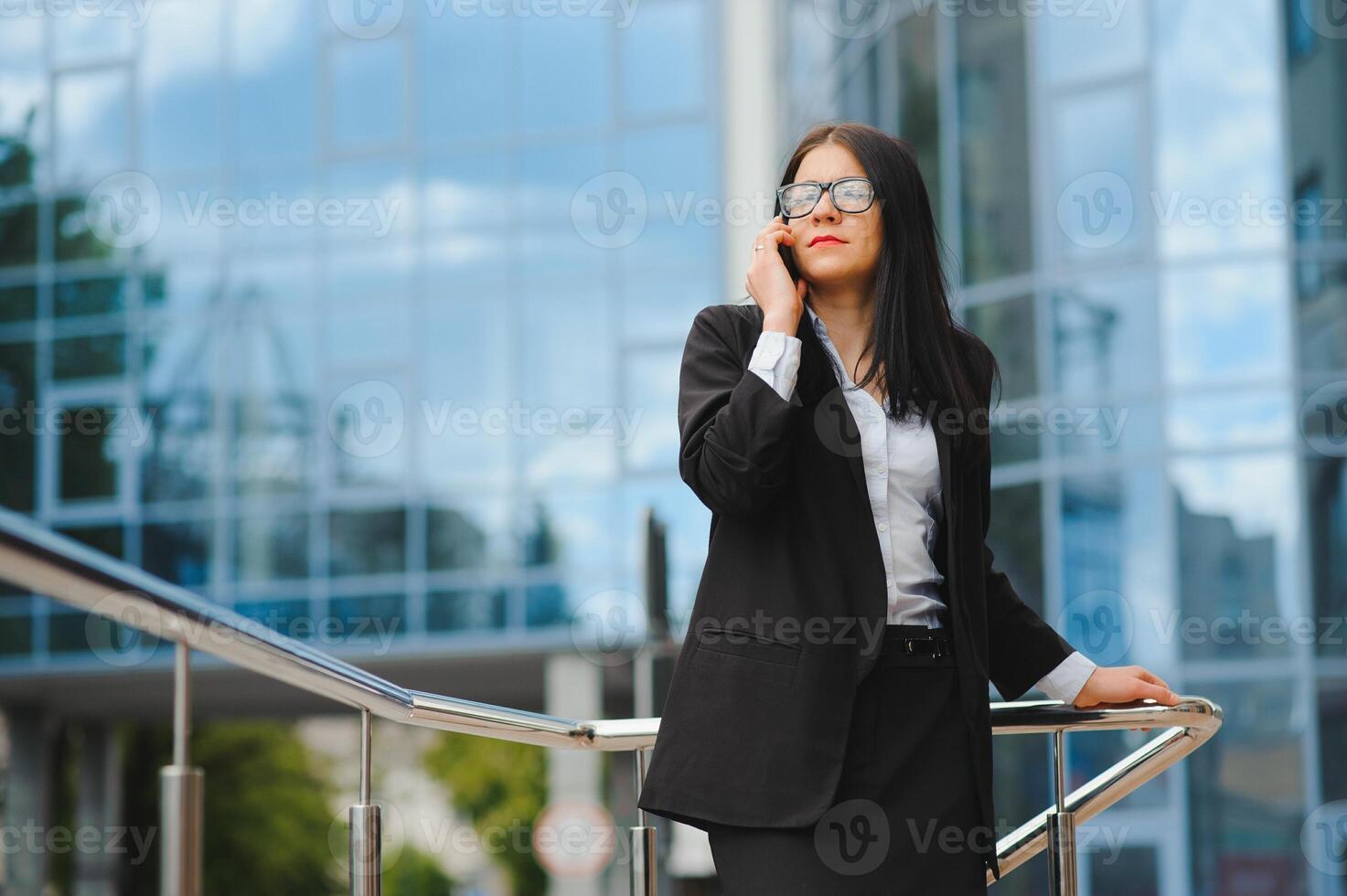 Girl with documents at a business meeting near a modern building photo