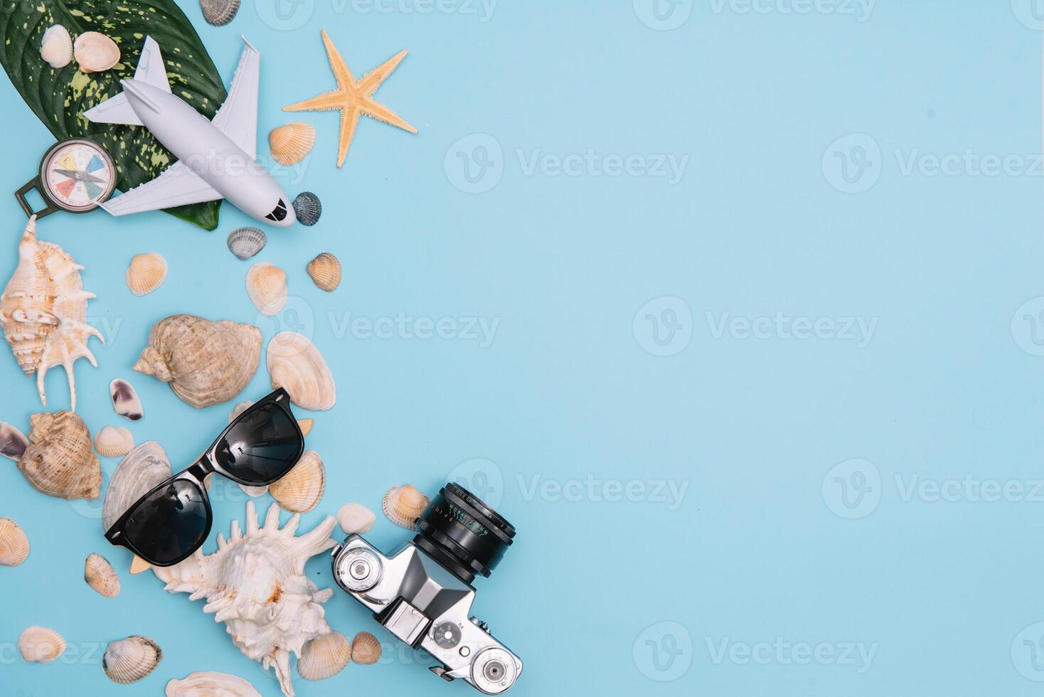 Travel accessories on blue background, travel concept. Top view with copy space photo