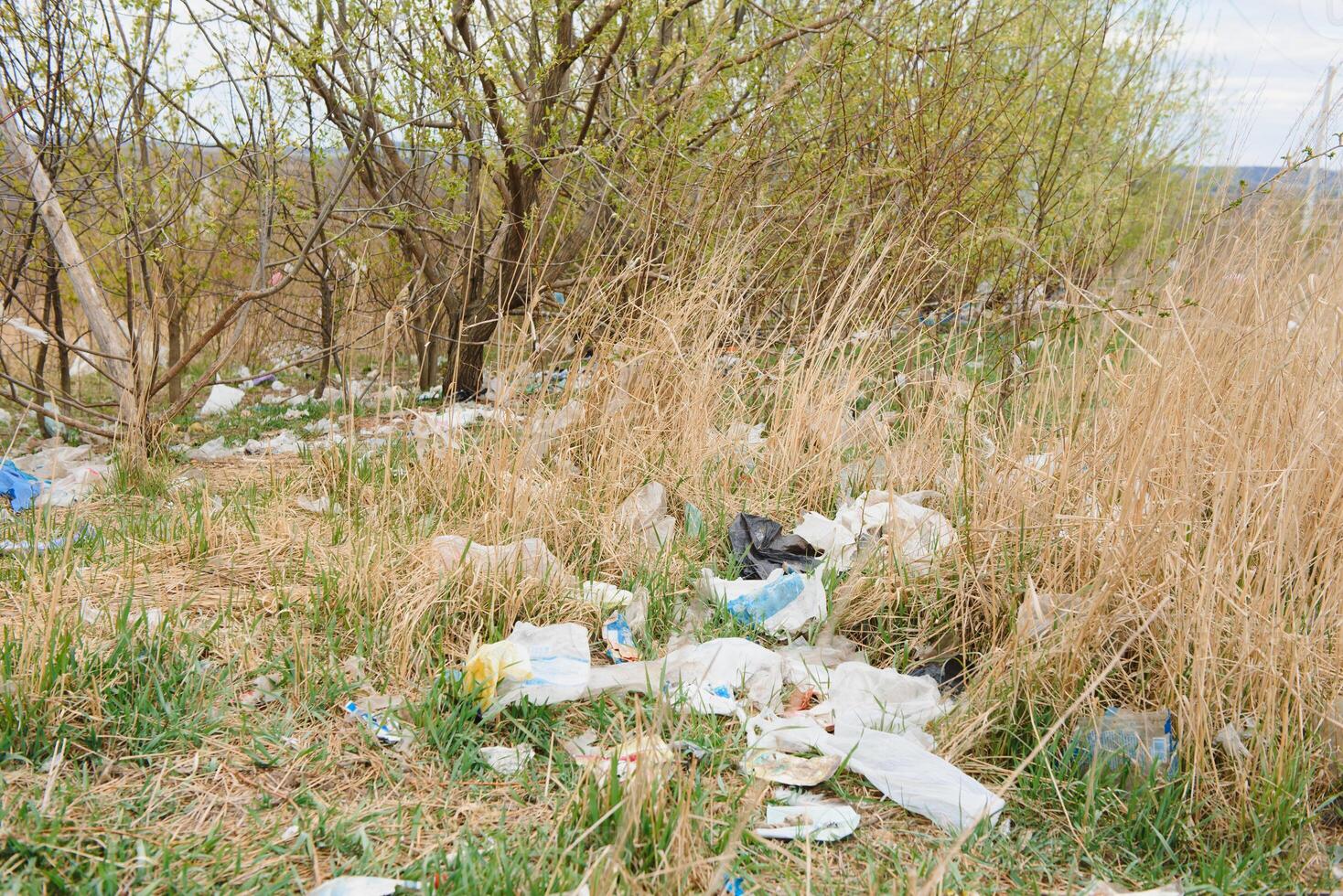 Ecology concept about mud and human activity - junk yard and garbage. Environmental pollution from industrial destruction at the city. photo