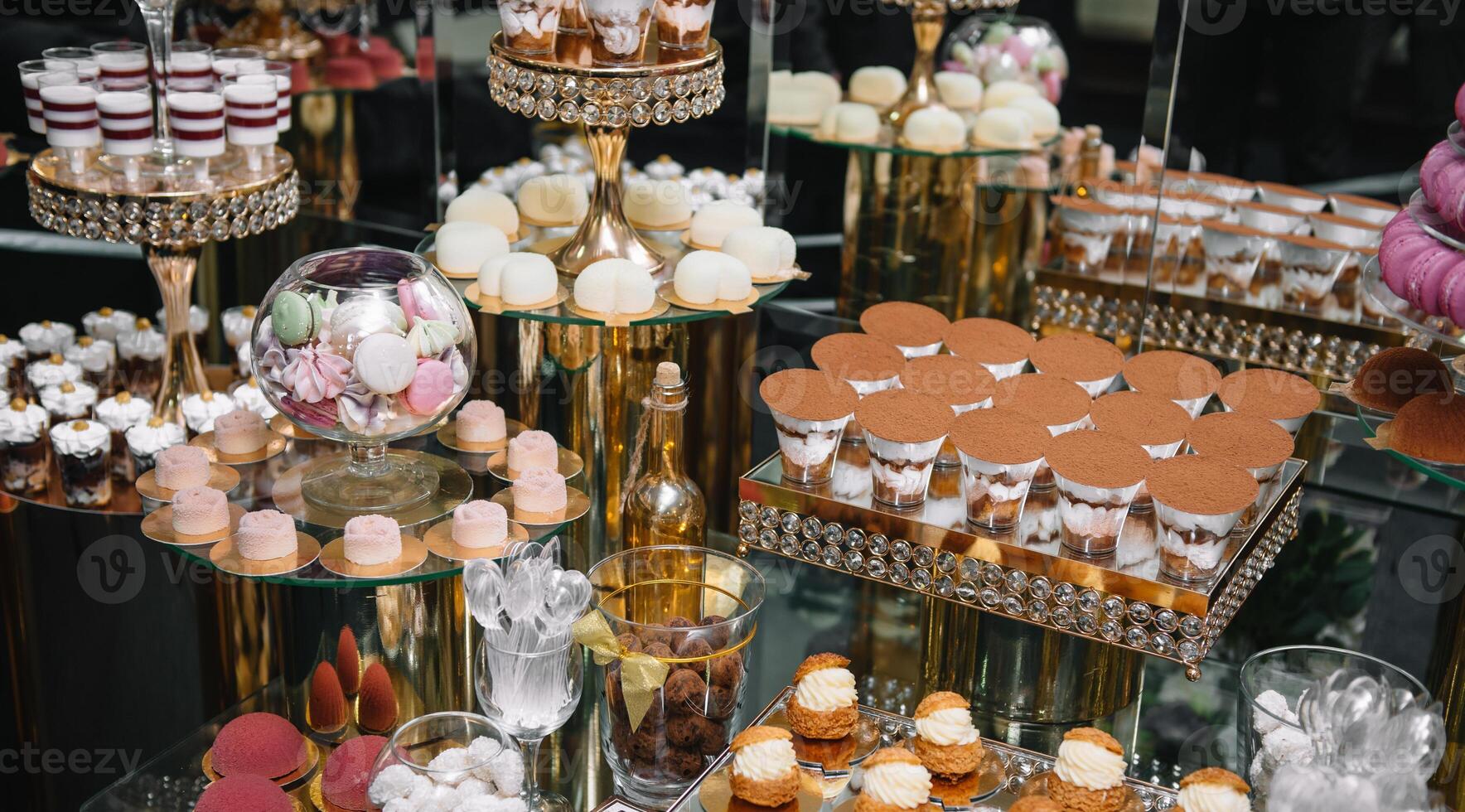 Delicious wedding reception candy bar dessert table. macaroon on candy bar, candy bar on holiday, candy bar at the wedding. photo