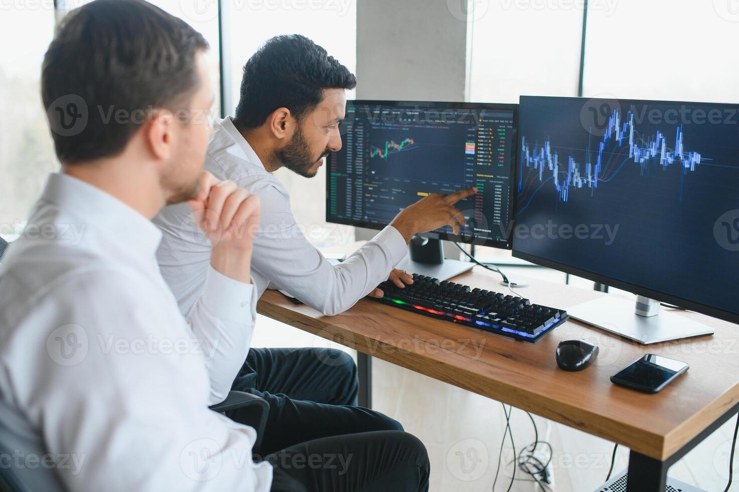 Two diverse crypto traders brokers stock exchange market investors discussing trading charts research reports growth using pc computer looking at screen analyzing invest strategy, financial risks. photo