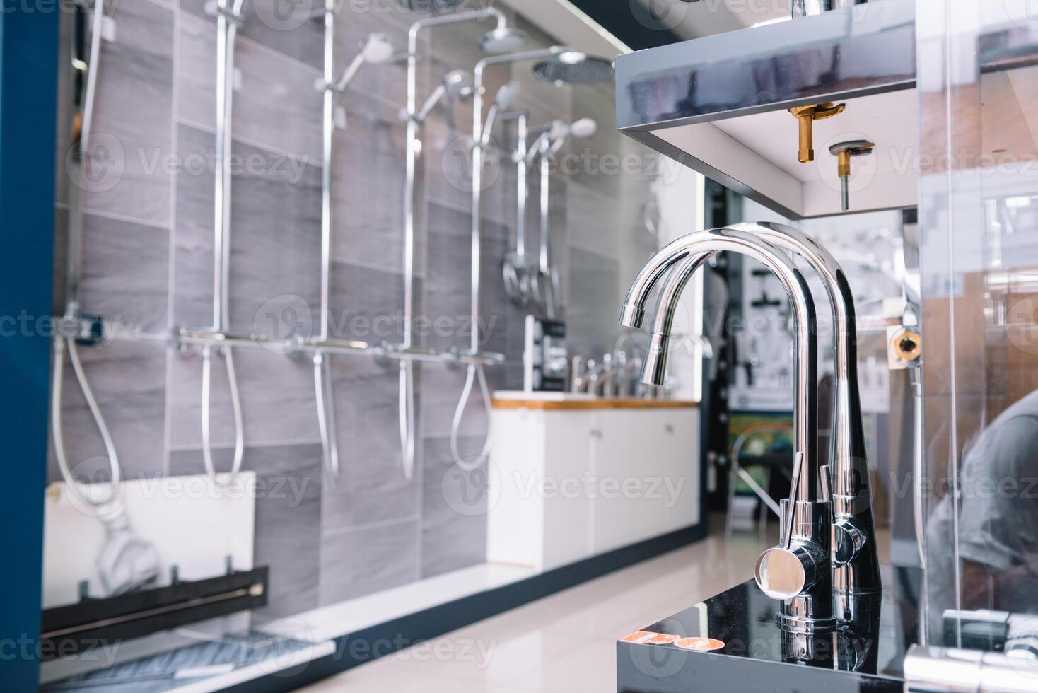 Rows of new faucets in plumbing shop, closeup. photo