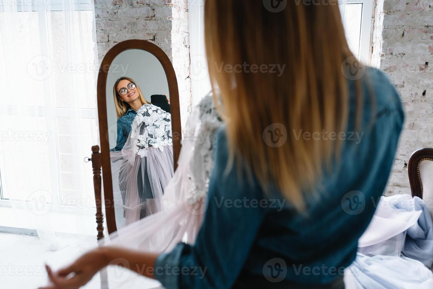 Fashion designer working in the studio photo