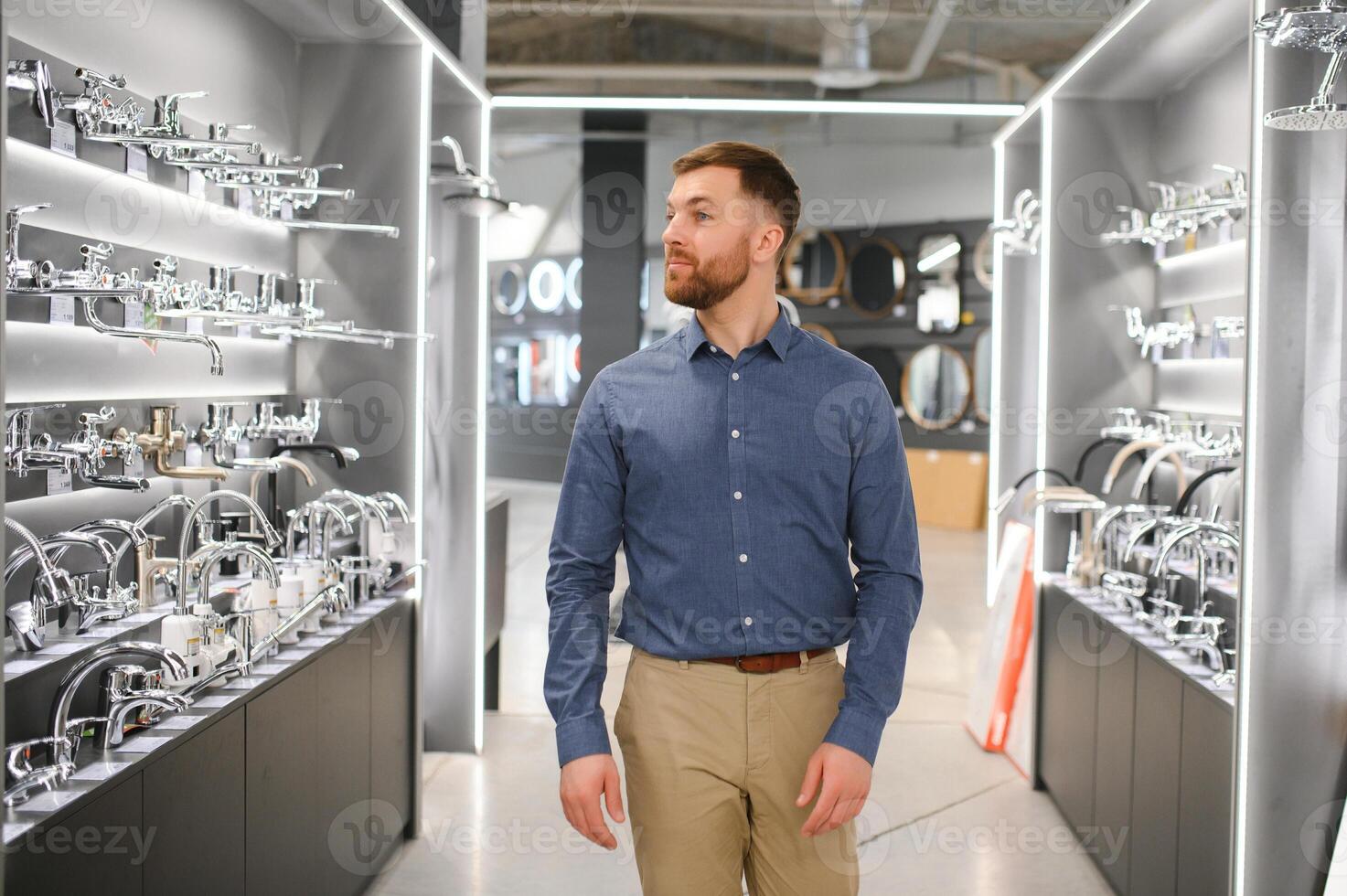 Man chooses a products in a sanitary ware store photo