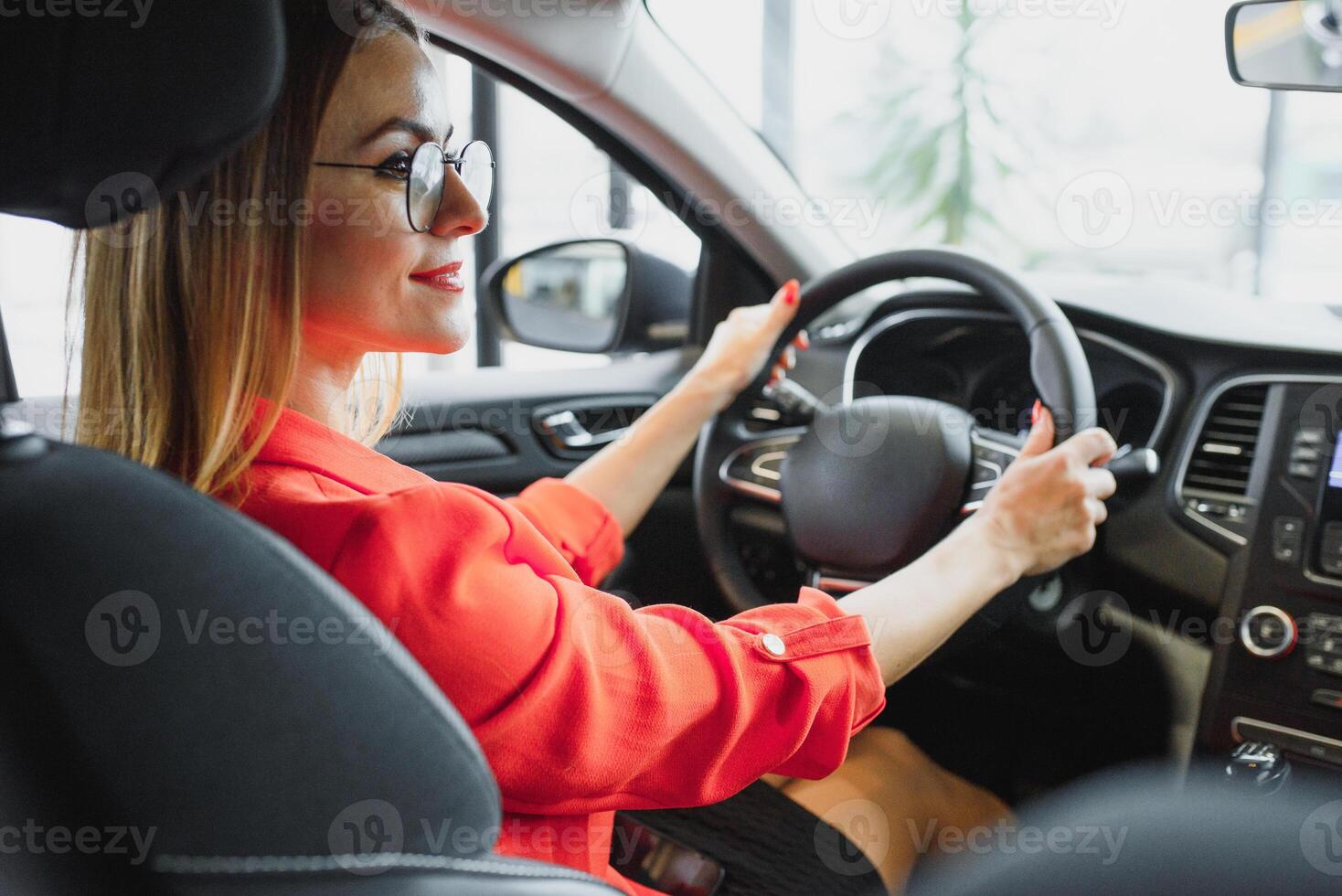 Business woman driving her new car photo