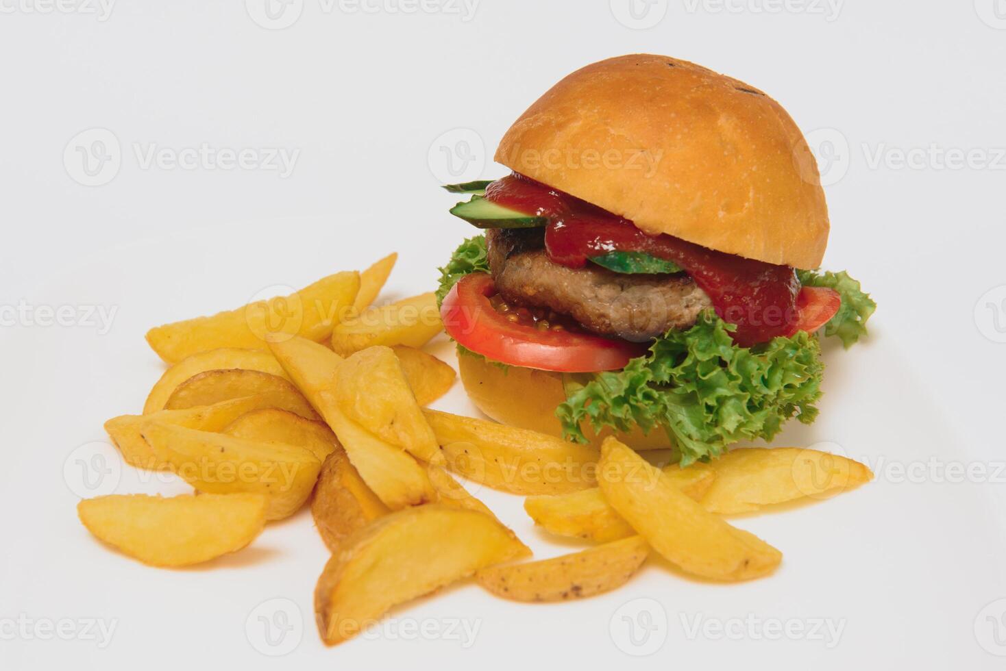 tasty hamburger, French fries and chili sauce on white plate, Fast food with copy space photo