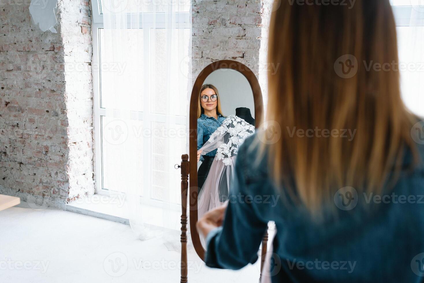 Fashion designer working in the studio photo