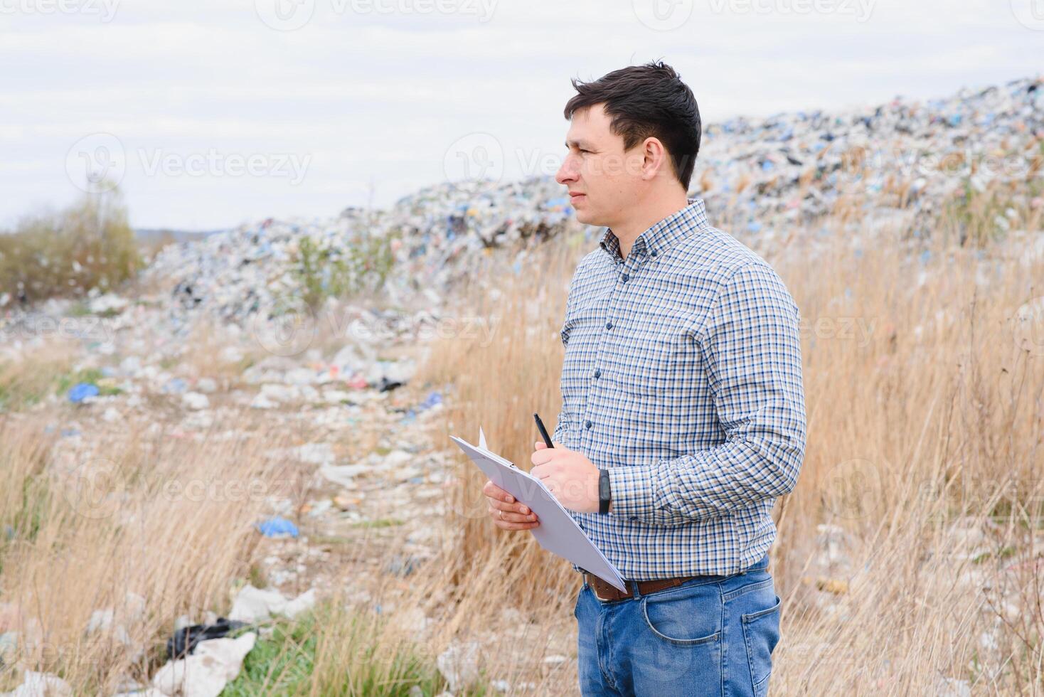 Nature conservation concept. A man studies the pollution of nature. Keeping the environment clean. Ecological problems. Recycling photo