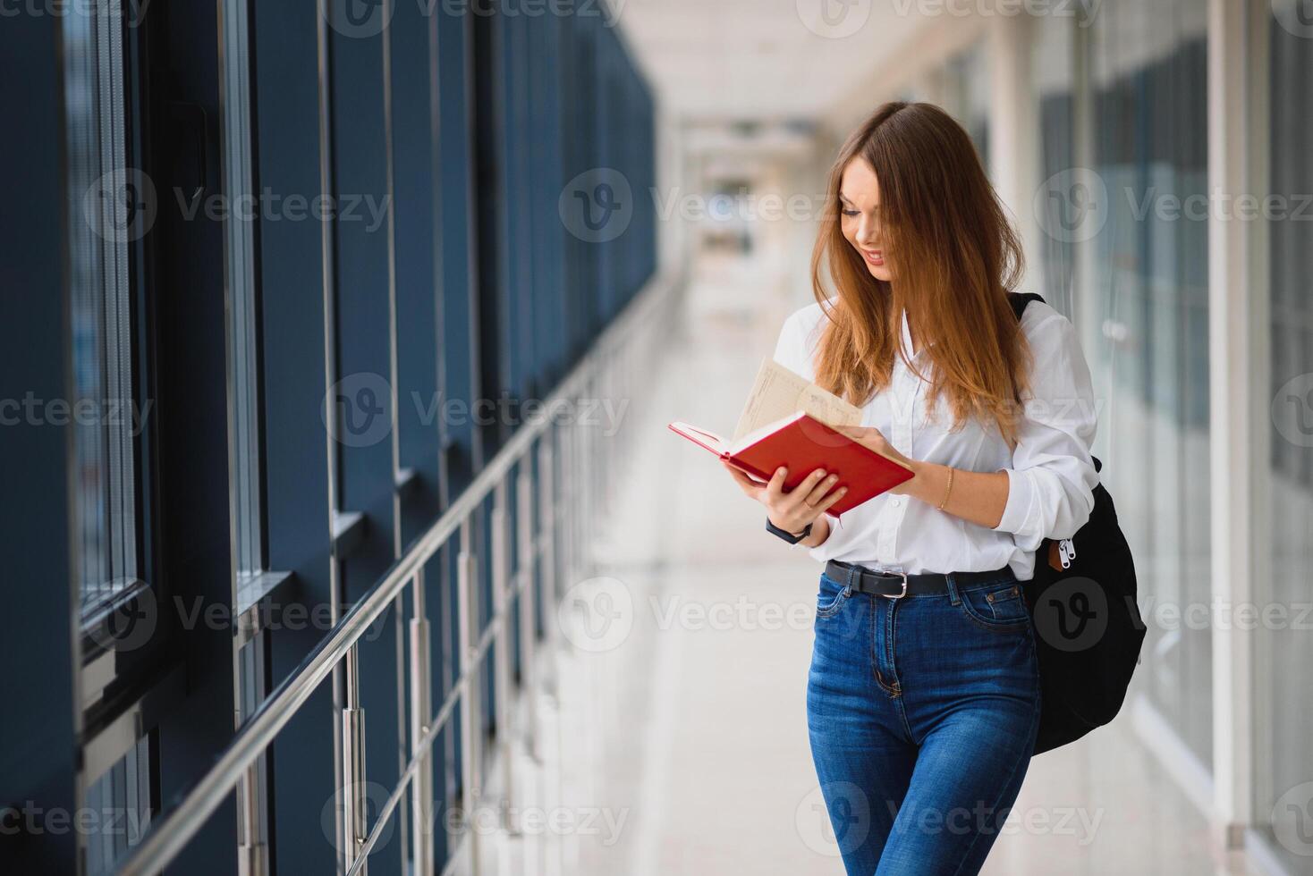 Smiling female student enhancing her future by attending regular lectures photo