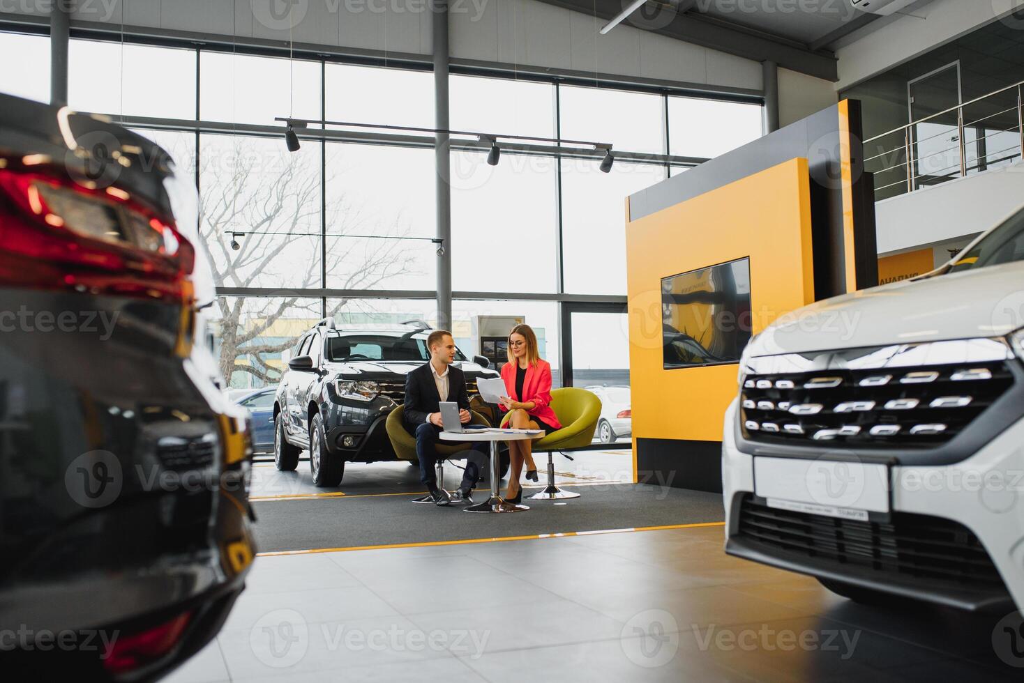Woman buying the car and seller selling photo