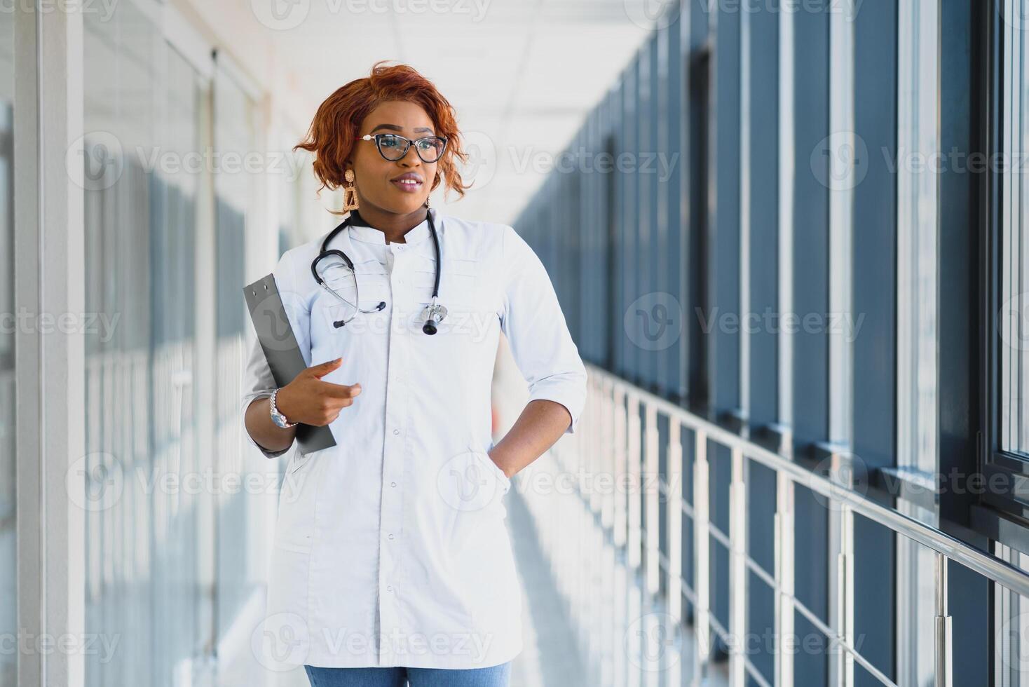 portrait of pretty african medical doctor. african american doctor in modern clinic photo