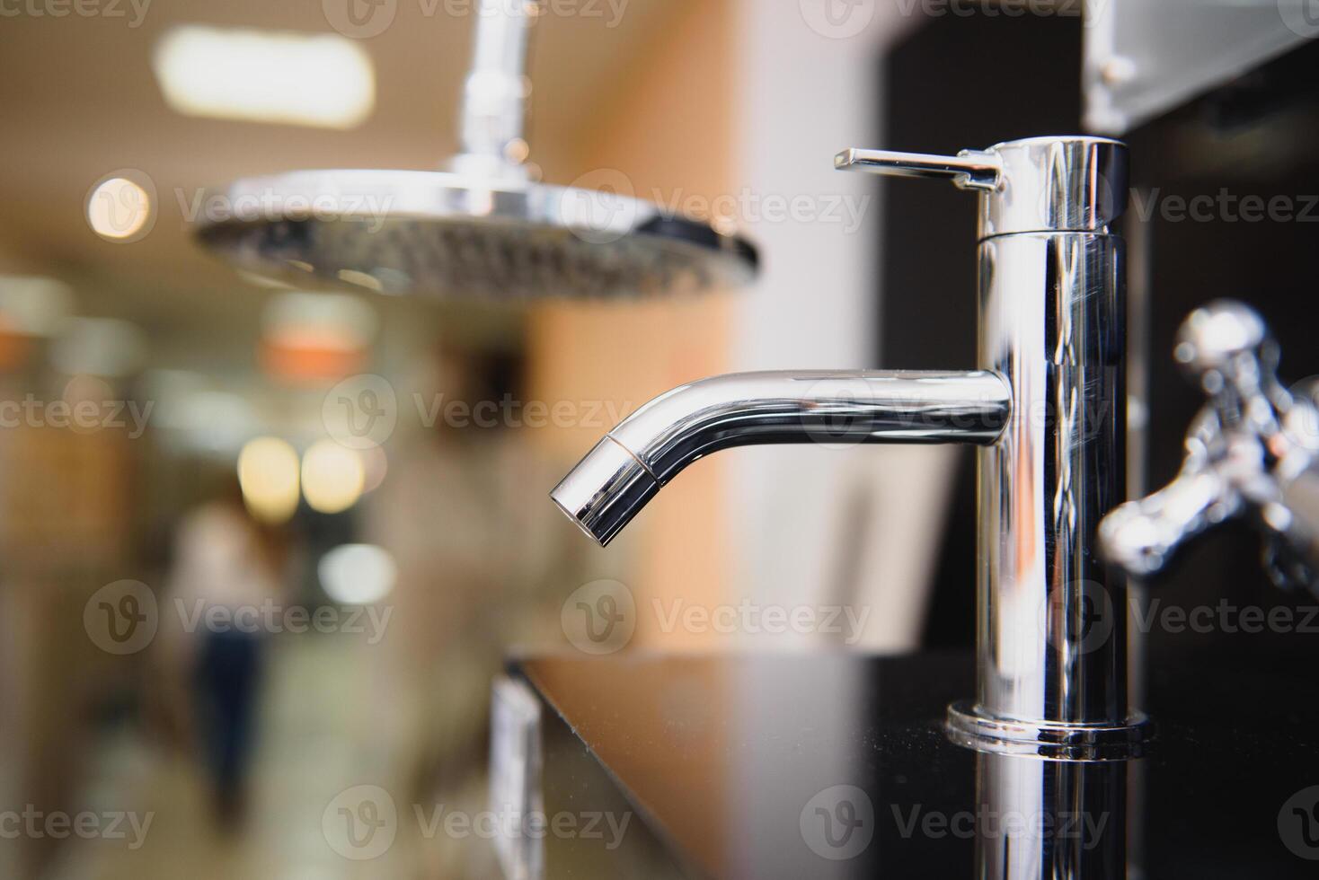 Rows of new faucets in plumbing shop, closeup photo