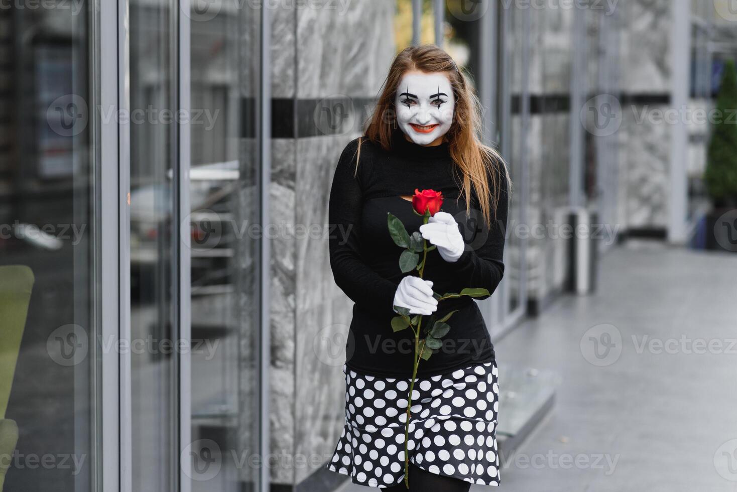 woman mime with red rose photo