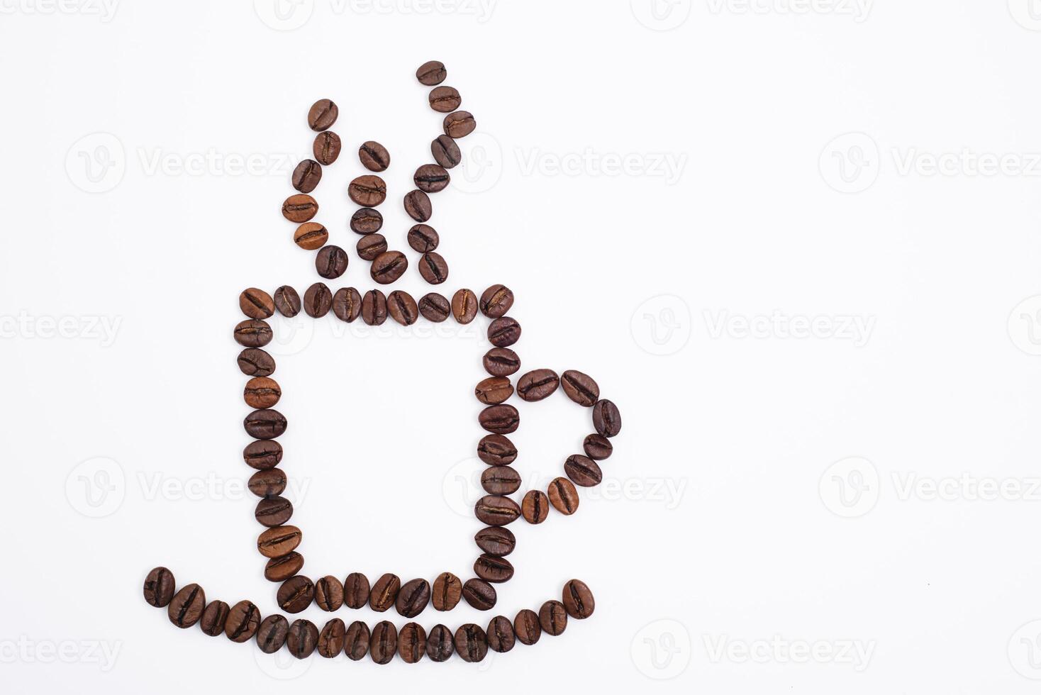 Coffee cup with foam made from coffee beans isolated on white photo