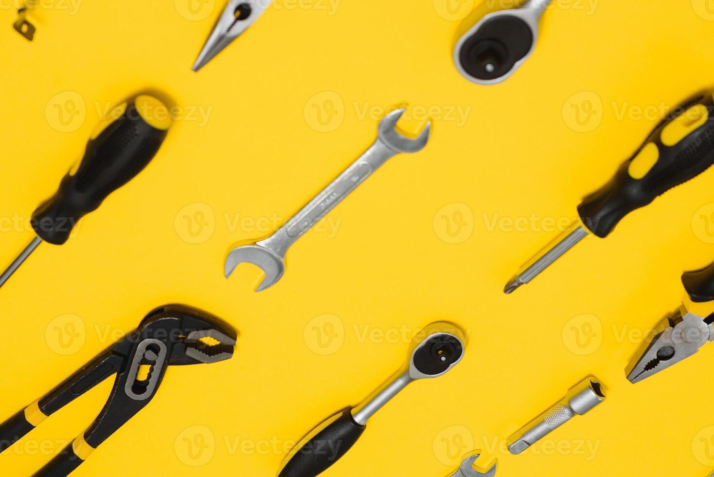 Set of various construction tools. Tools for home repair. Work at a construction site. On a yellow background. Flatly. Flatlay photo