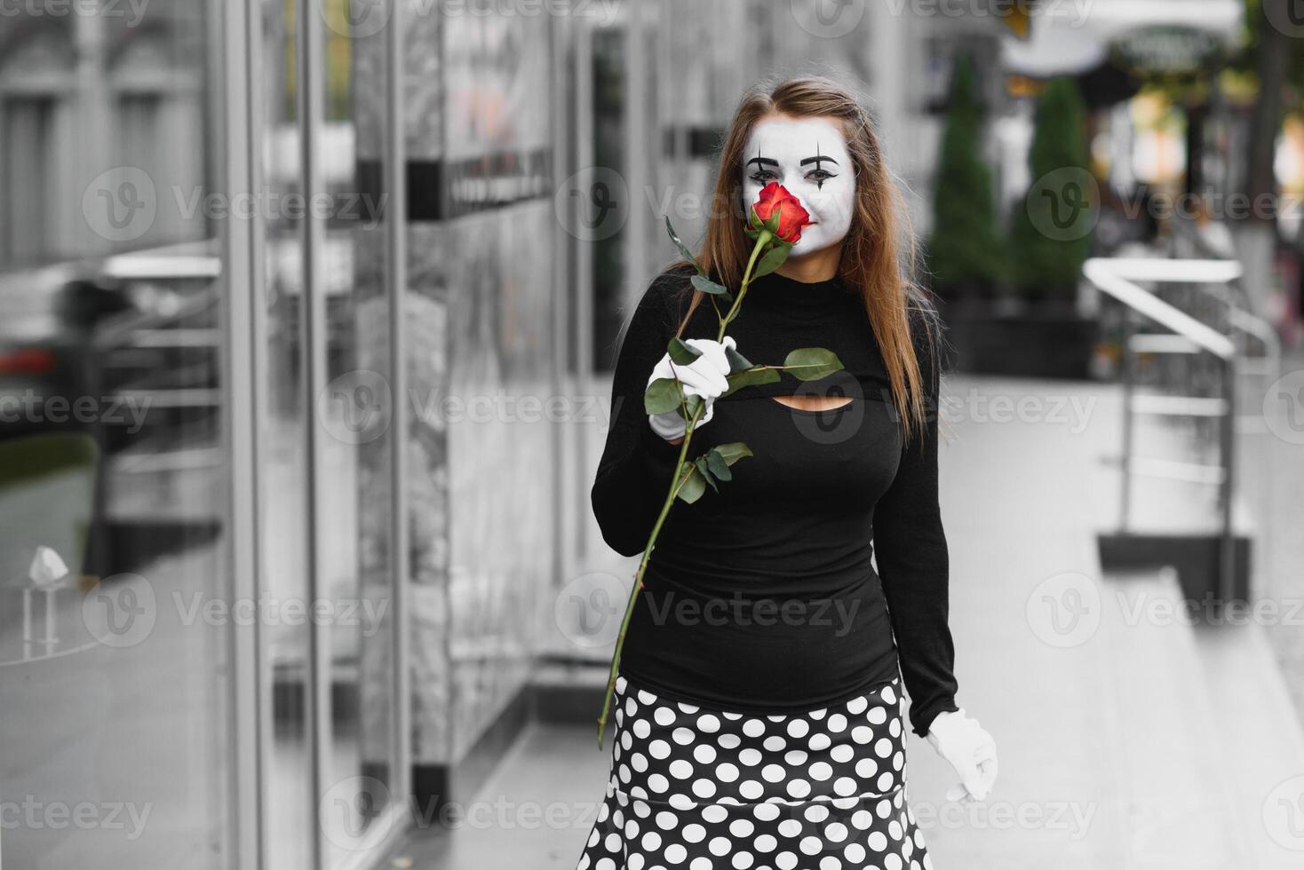 woman mime with red rose photo