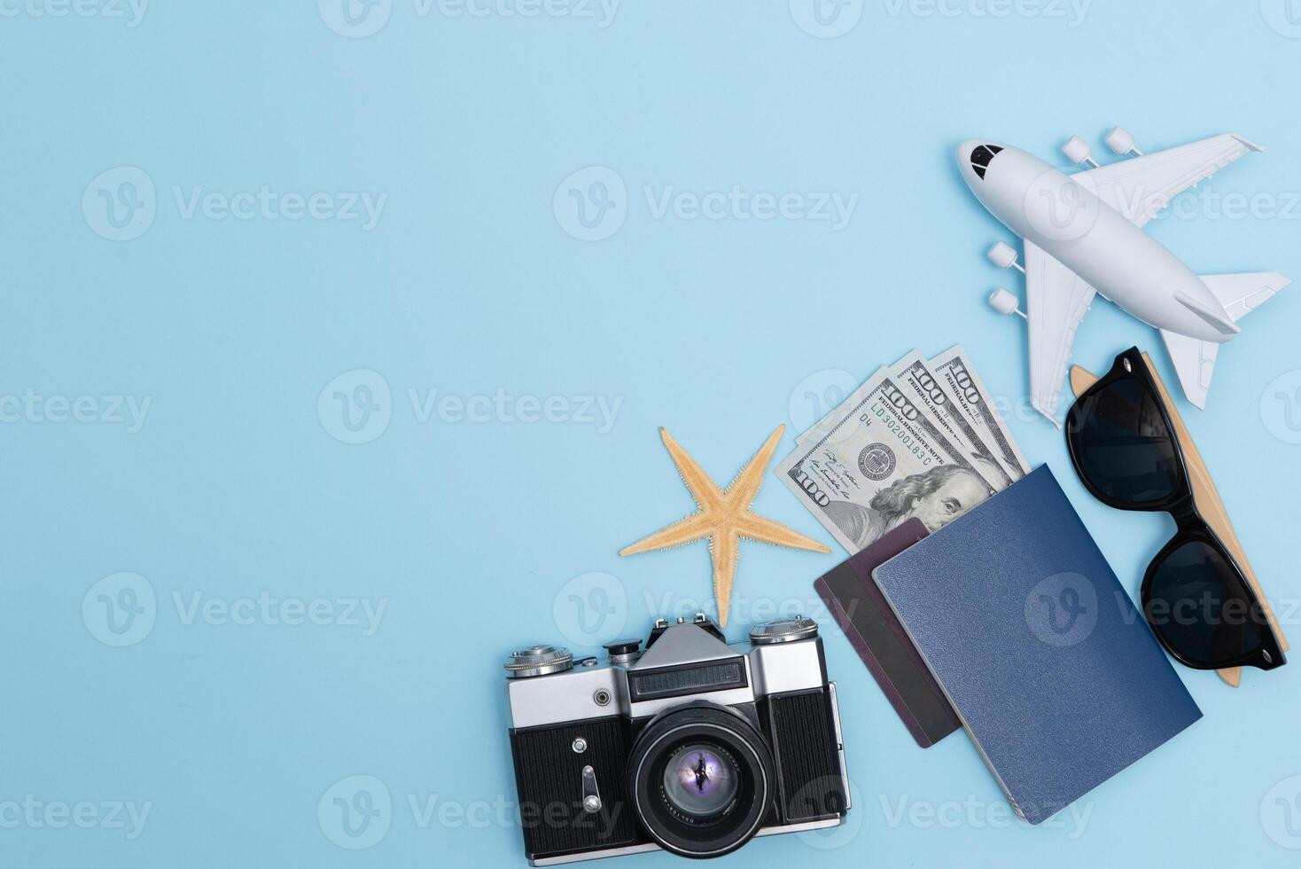 Travel accessories on blue background, travel concept. Top view with copy space photo