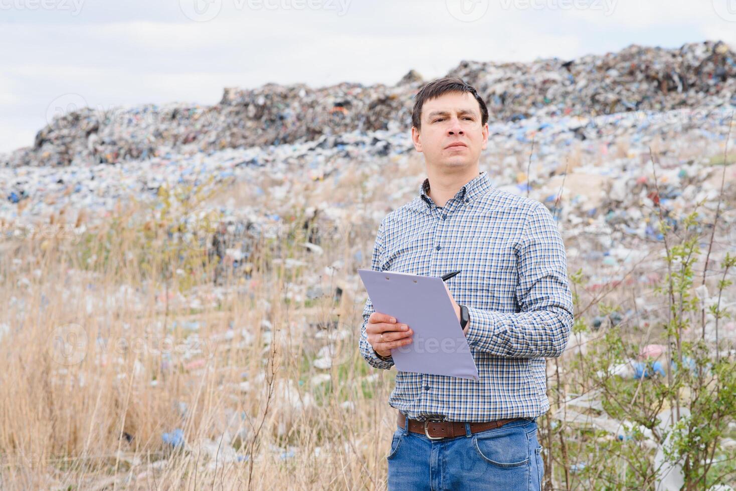 Nature conservation concept. A man studies the pollution of nature. Keeping the environment clean. Ecological problems. Recycling photo