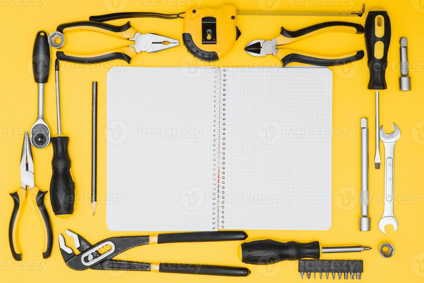 Set of various construction tools. Tools for home repair. Work at a construction site. On a yellow background. Flatly. Flatlay photo