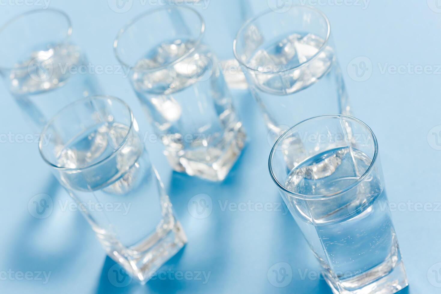 top of view of drink glasses with water, nutrition and health-care concept, nutrition and health-care concept on white background photo