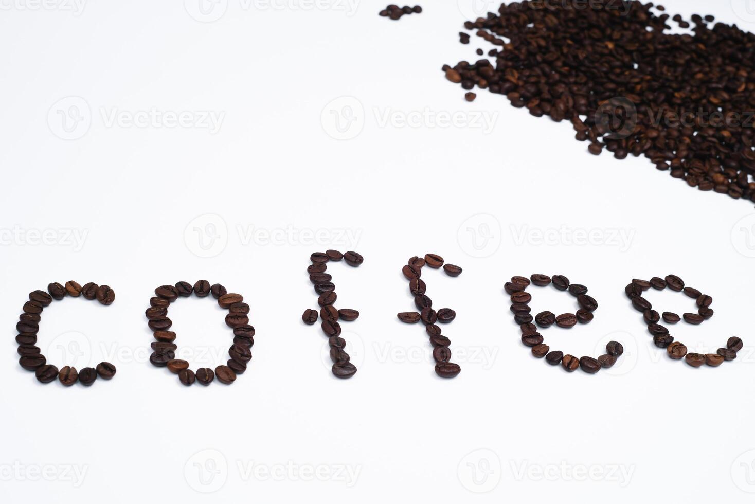 Word coffee made from coffee beans isolated on white background photo