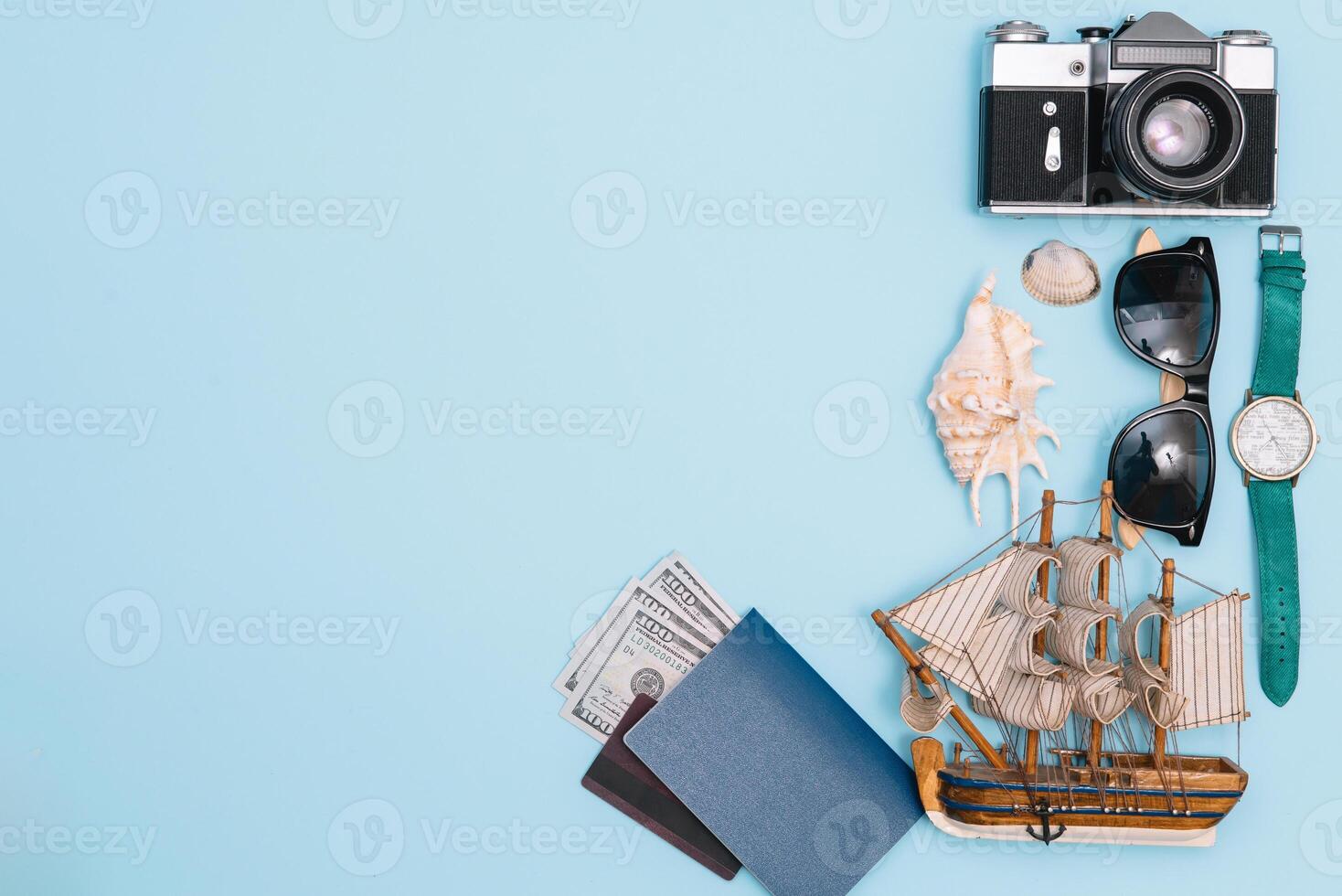 Travel accessories on blue background, travel concept. Top view with copy space photo