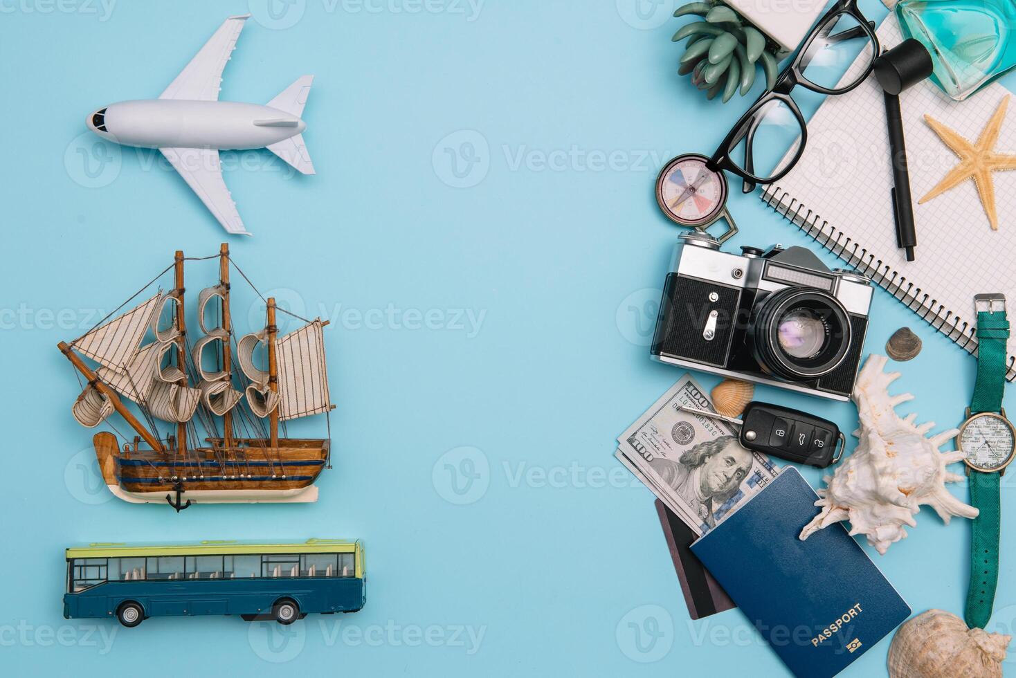 Travel accessories on blue background, travel concept. Top view with copy space photo