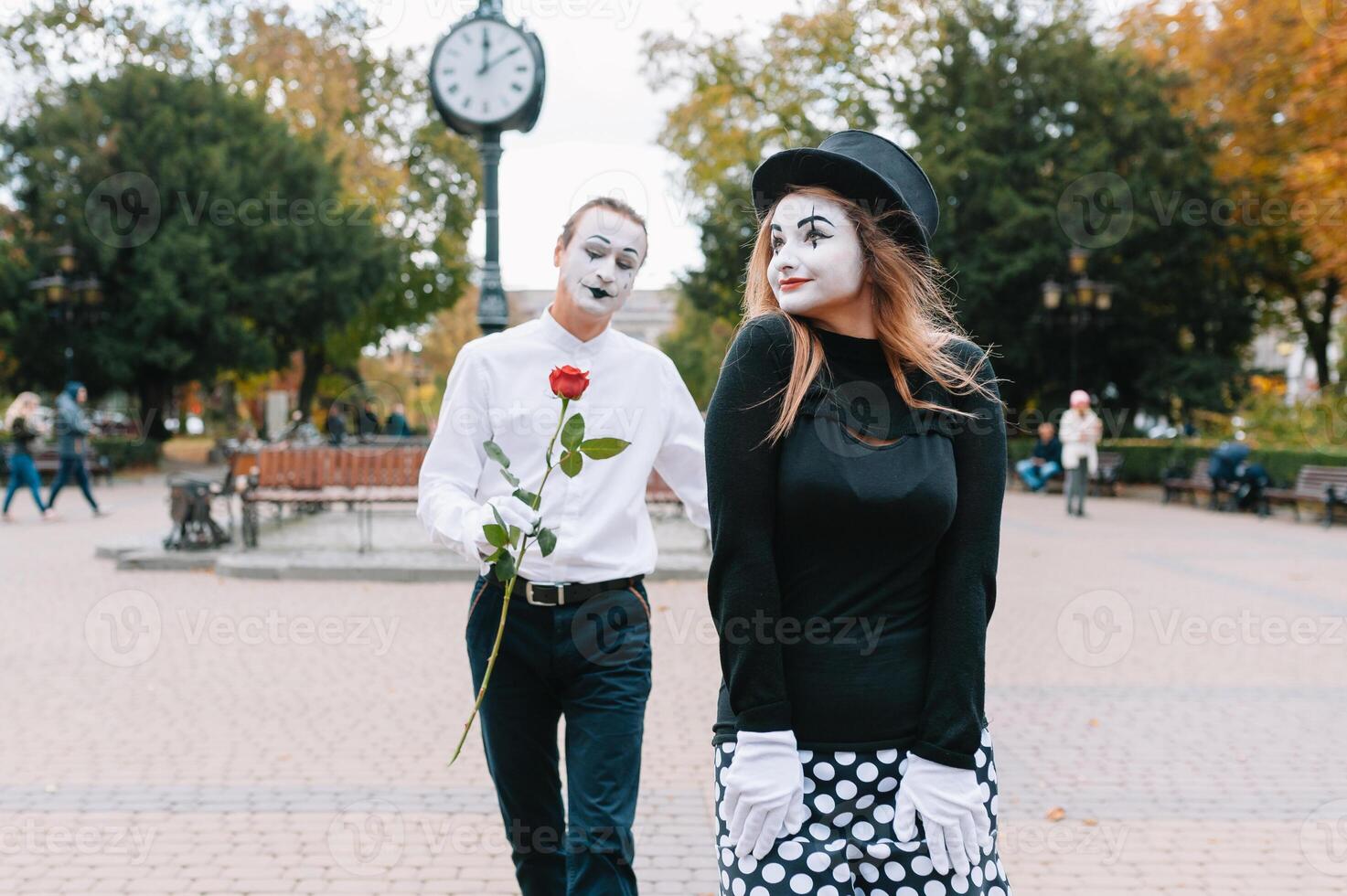 Mime on the street waiting to meet with his lover. Portrait of a mime comedian. mime on the street photo