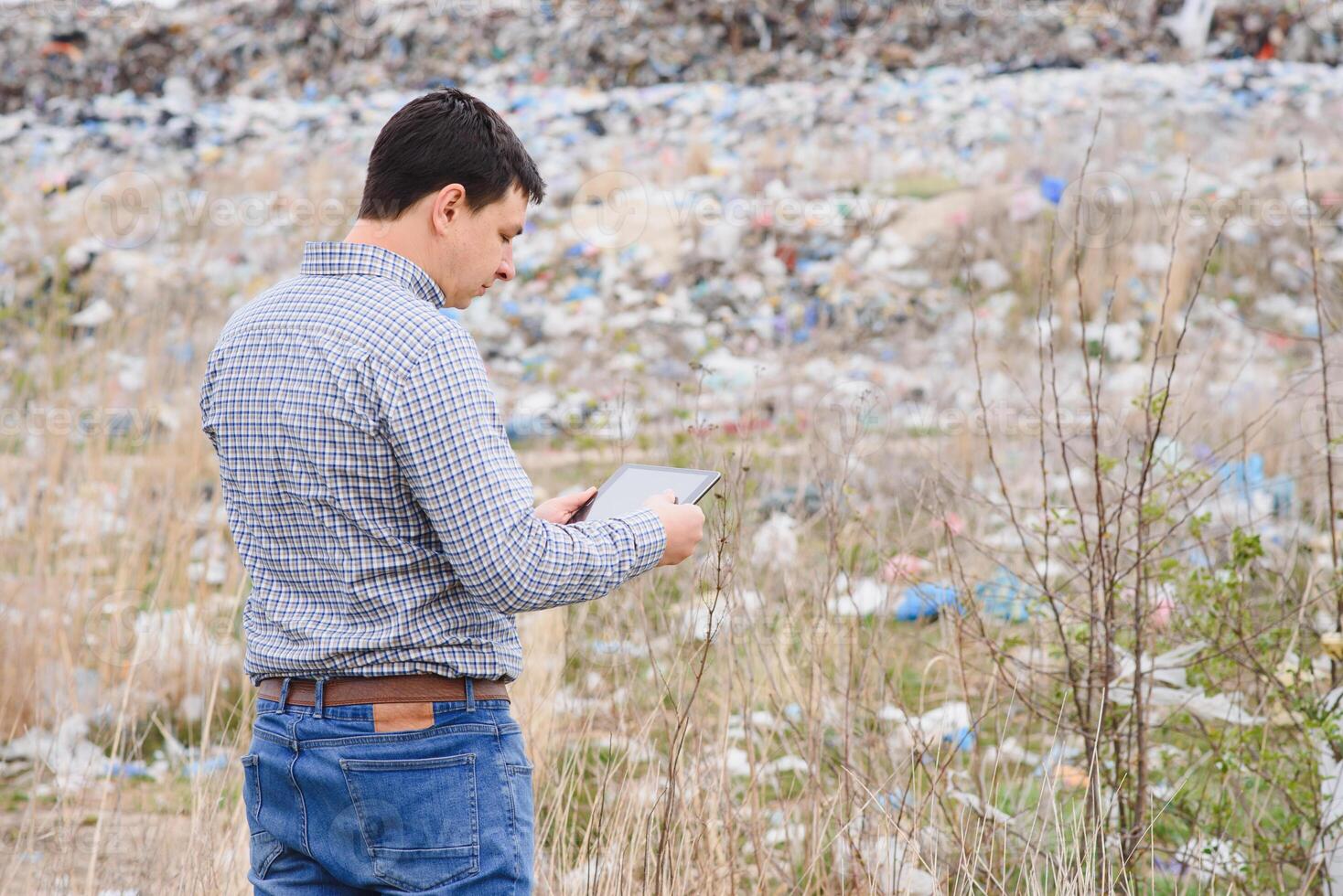 garbage recycling concept. man on dumpster. Keeping the environment clean. Ecological problems. photo