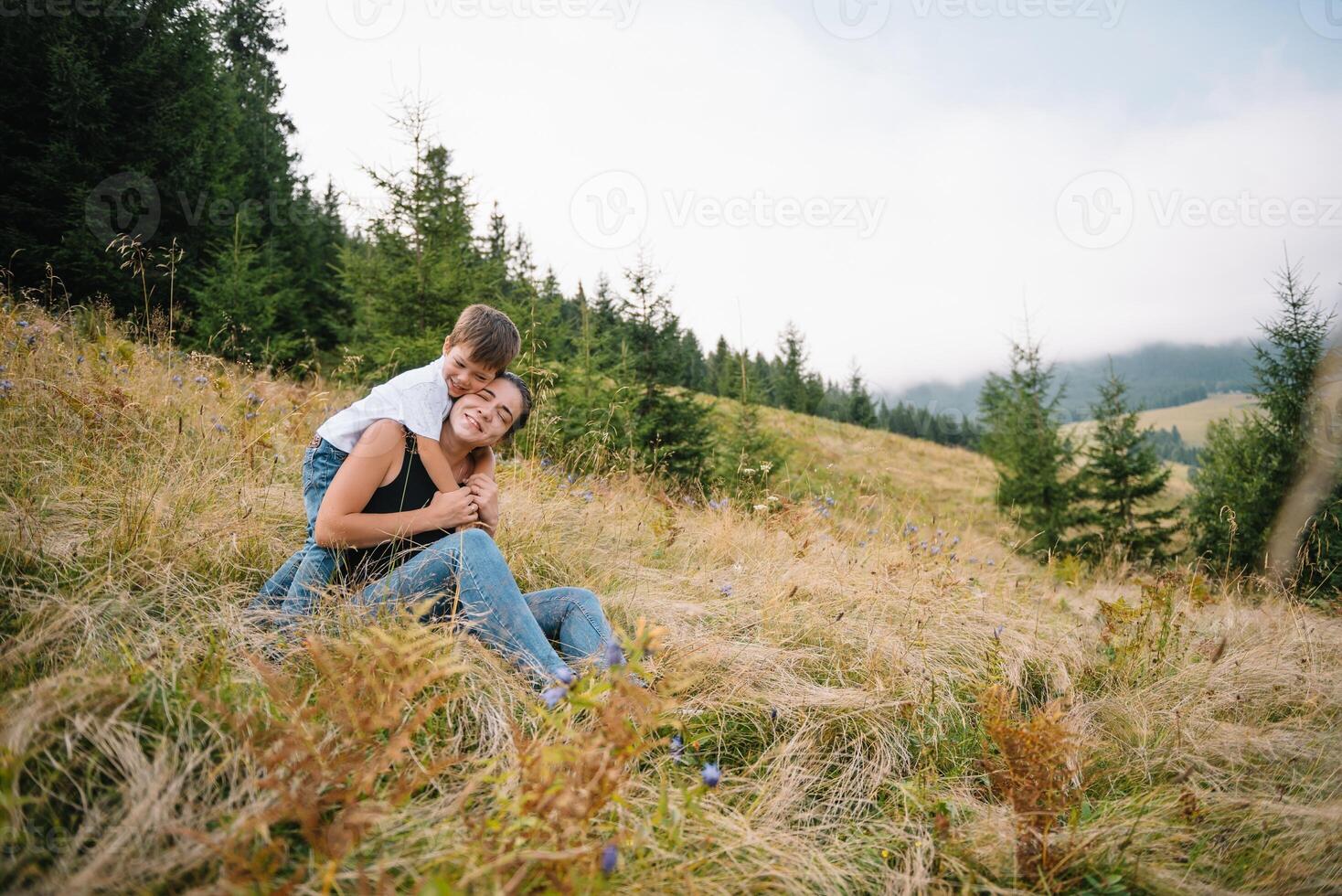 Young mom with baby boy travelling. Mother on hiking adventure with child, family trip in mountains. National Park. Hike with children. Active summer holidays. photo