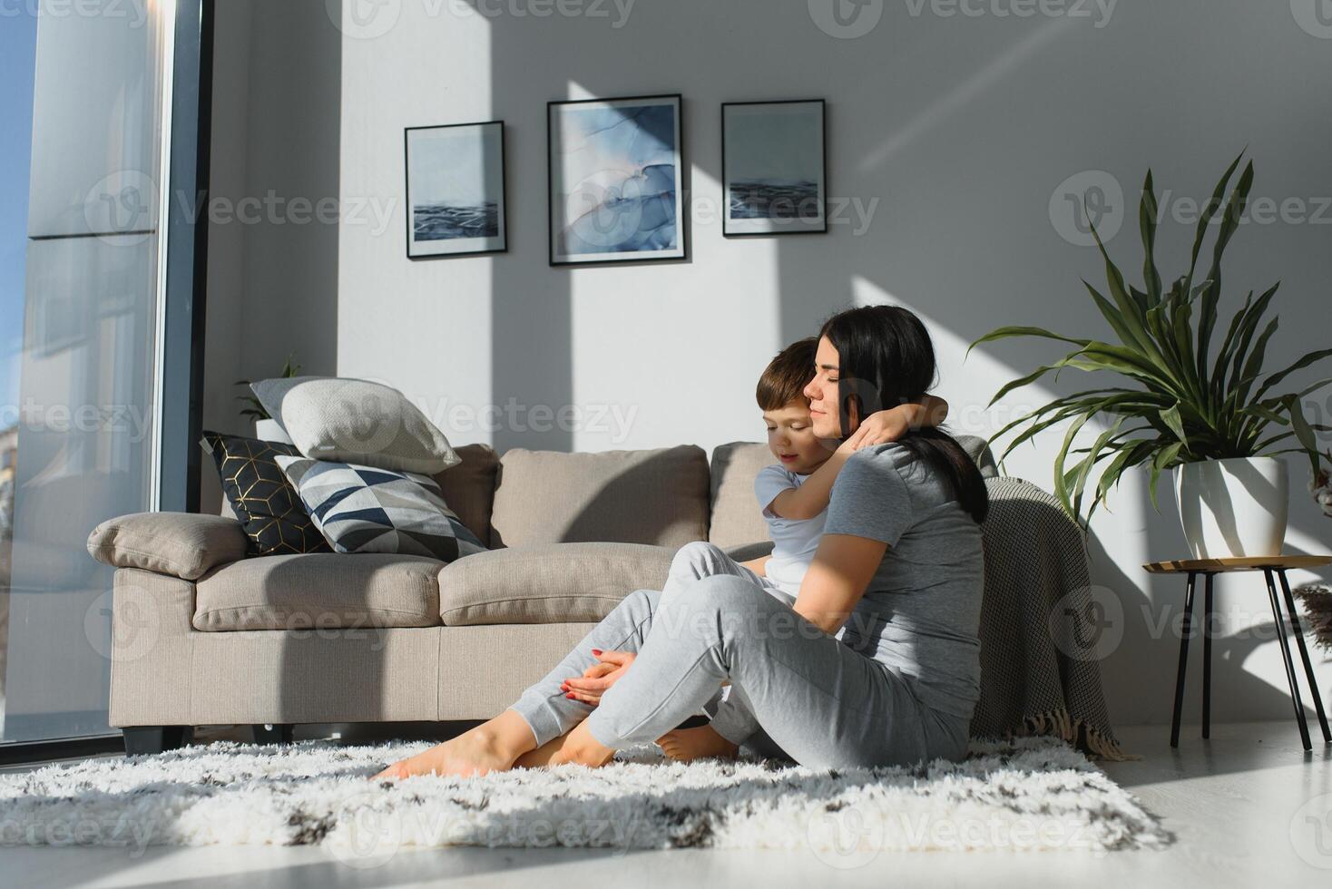 Closeup of happy family playing over the bed in a relaxed morning. Weekend family leisure time concept. photo