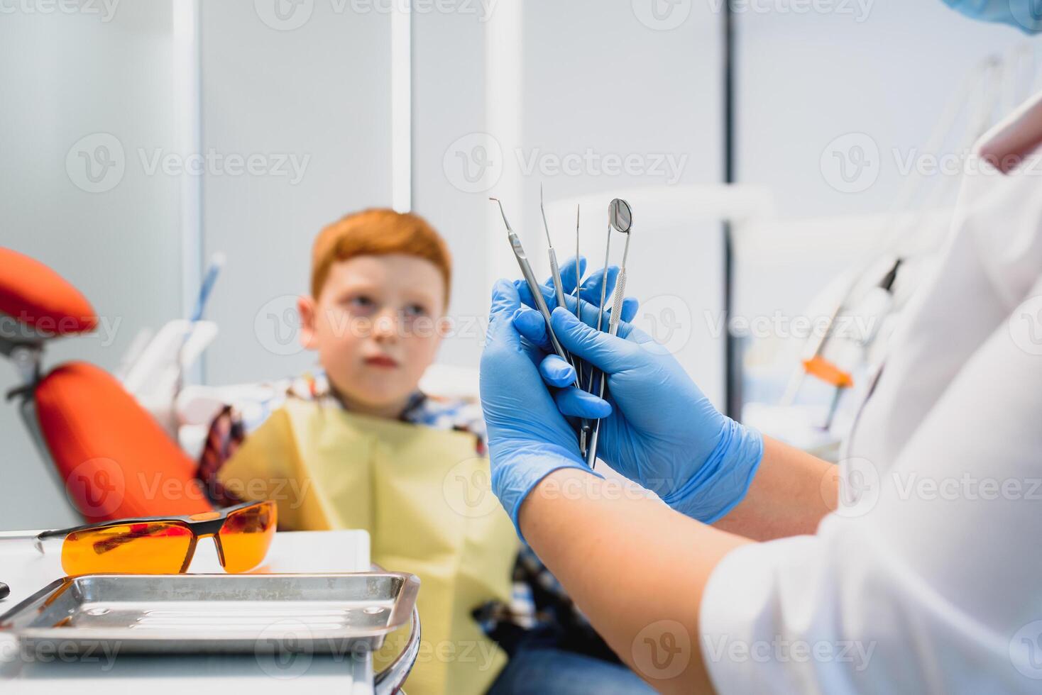 Female dentist and child in a dentist office photo