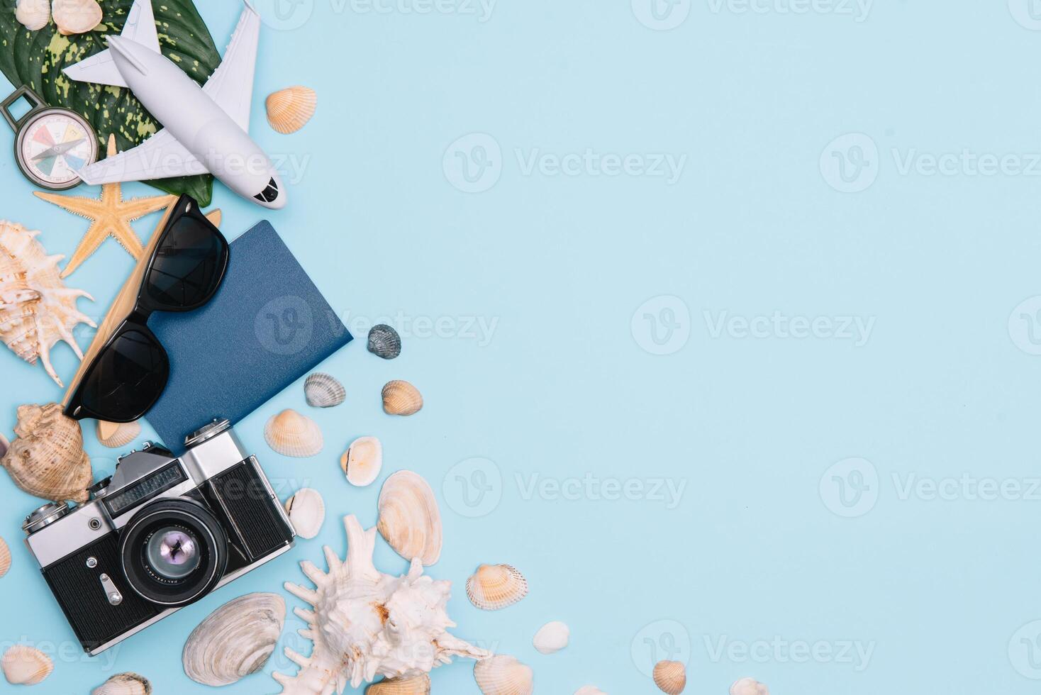 Travel accessories on blue background, travel concept. Top view with copy space photo