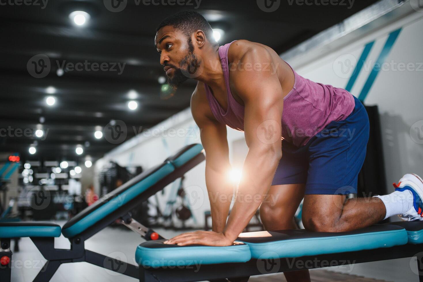 Portrait african american bodybuilder at gym intense intimidating glare expression conviction. photo