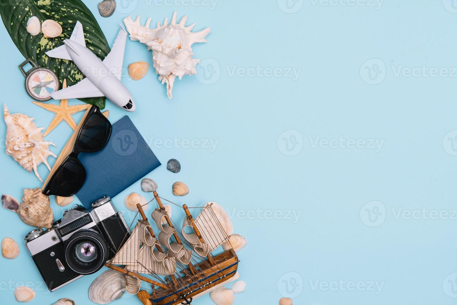 Preparation for Traveling concept, watch, airplane, money, passport, pencils, book, Photo frame, eyeglass on blue background with copy space