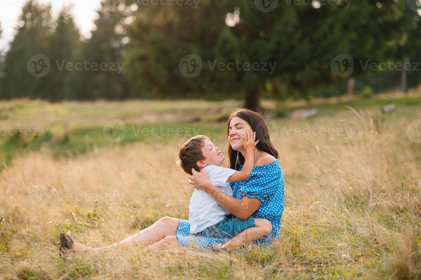 mother and son having rest on vacation in mountains. photo