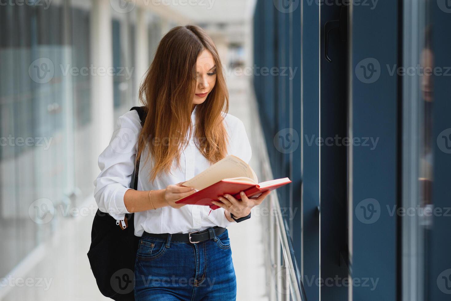 Smiling female student enhancing her future by attending regular lectures photo