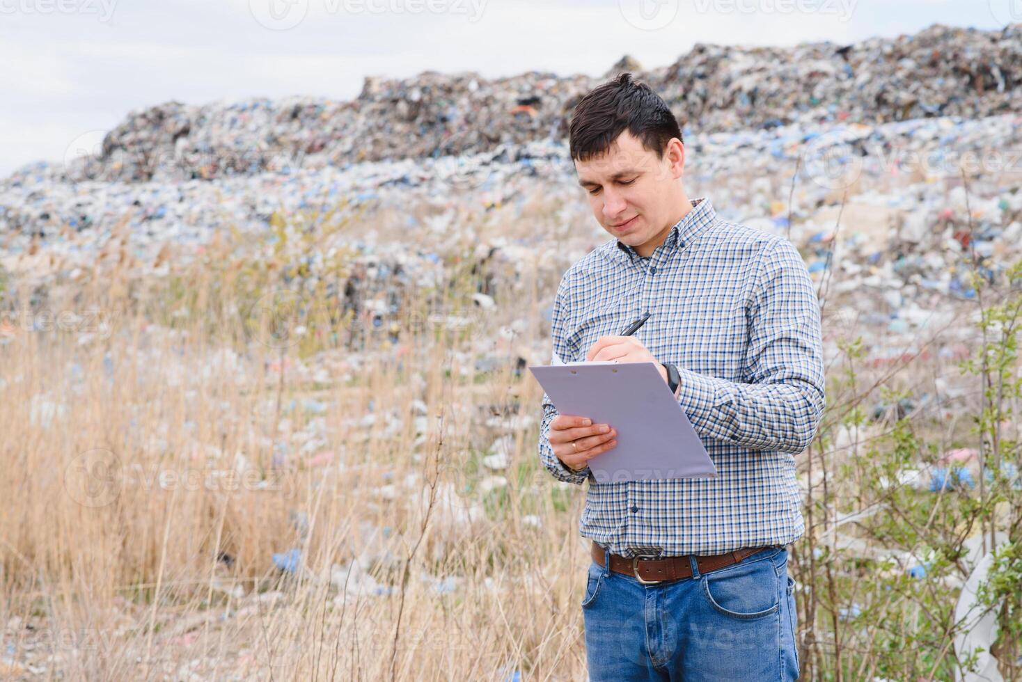 garbage recycling concept. man on dumpster. Keeping the environment clean. Ecological problems. photo